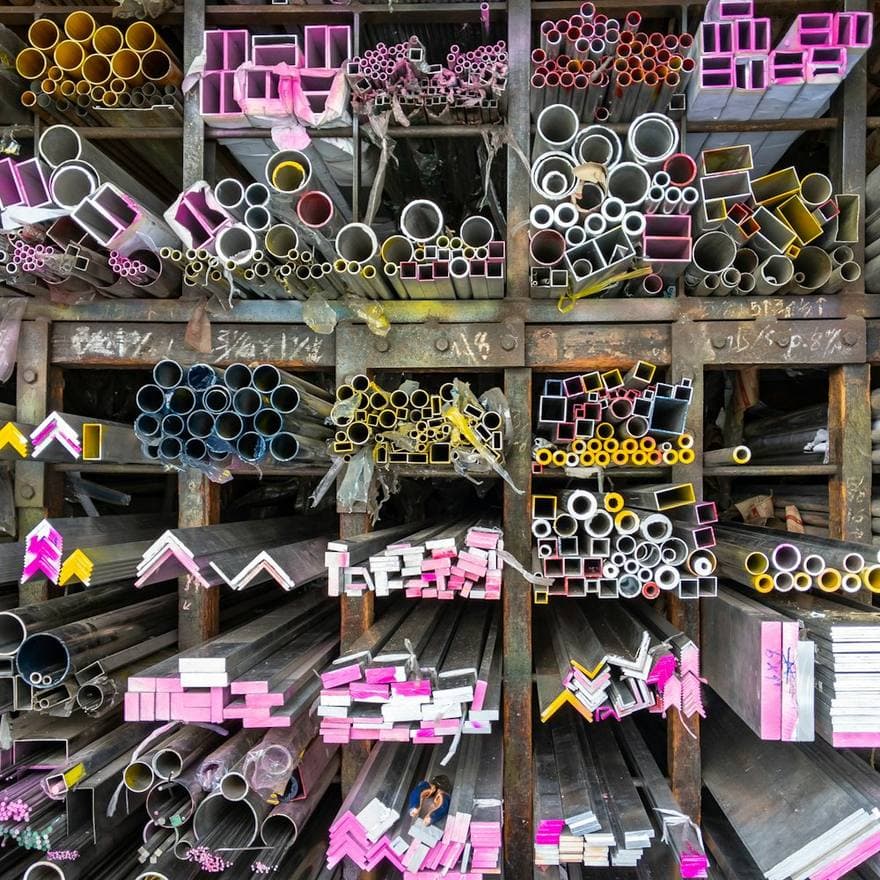 Warehouse racks stocked with aluminium profiles